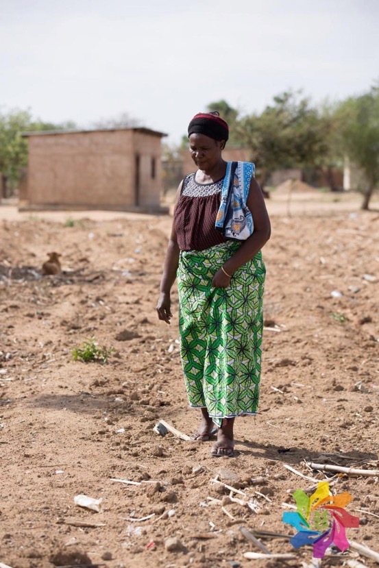 Maize farmer Regina Mwashilemo surveys her dry land. Photo by Hannah Smith Walker